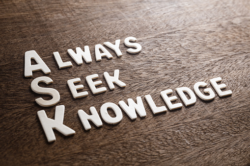 Ask Acronym (Always Seek Knowledge) wood letters on wood texture