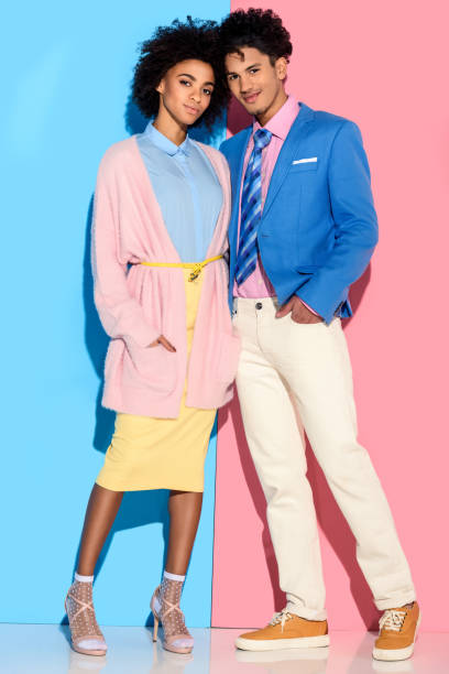 istock girl and guy hugging on pink and blue background 902145198