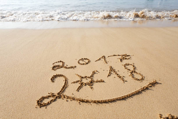 istock Happy New Year 2018 on the beach 902149988