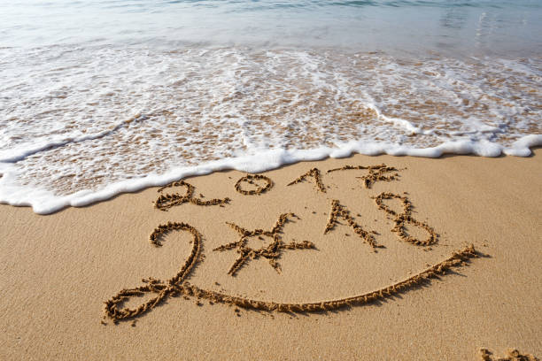 istock Happy New Year 2018 on the beach 902149990