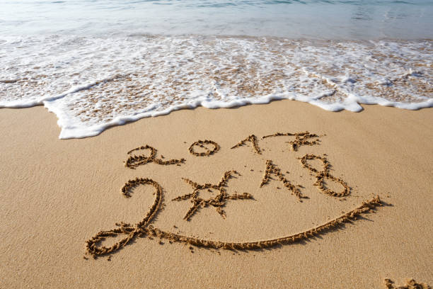 istock Happy New Year 2018 on the beach 902149998