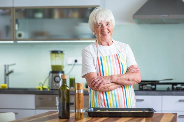 istock Senior woman cooking in the kitchen 902152924