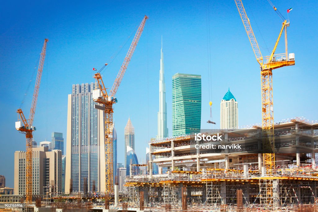 Construction of new buildings in Dubai Construction of new modern skyscrapers in Dubai, United Arab Emirates Construction Site Stock Photo