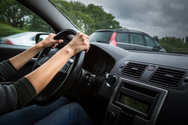istock Male driver's hands driving a car on a highway 902156498