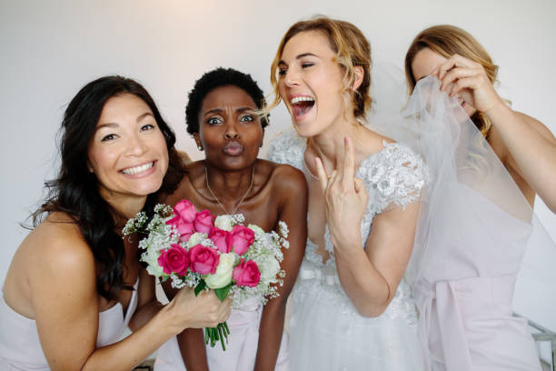 istock Cheerful bridesmaids with the bride on wedding day 902164658