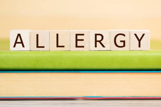 istock Allergy word built with letter cubes on green book 902168704