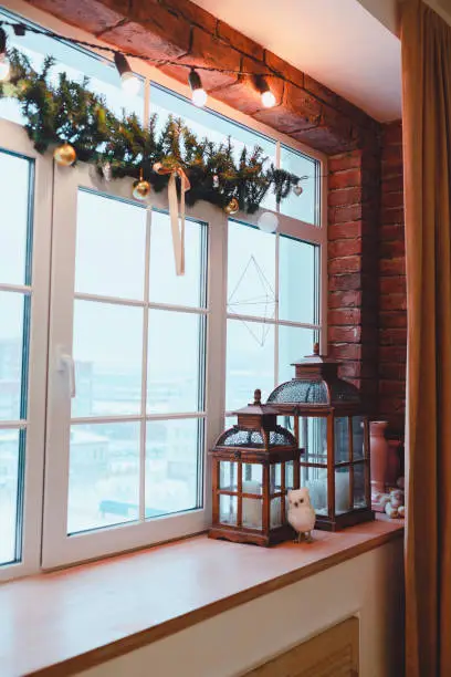 Photo of loft interior. Window view. Christmas time