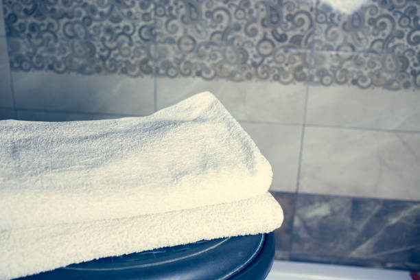 istock Blurred bathroom interior background and white spa towels on Marble 902172296
