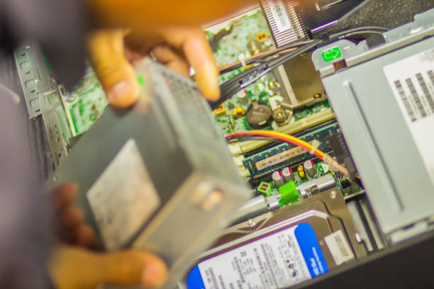 istock Close up hands of technician during repair desktop computer 902173014