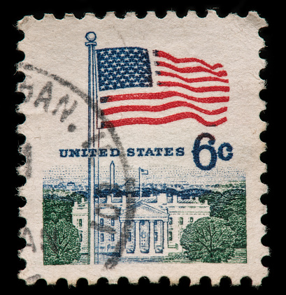 Image of USA flag and White House Stamp with black background.