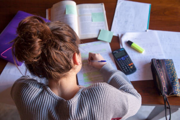 Teenager doing homework Teenager doing homework homework stock pictures, royalty-free photos & images