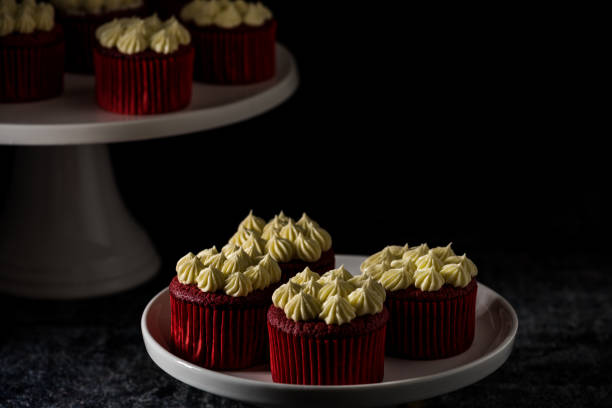 istock Red Velvet cup cakes with cream cheese frosting 902179350