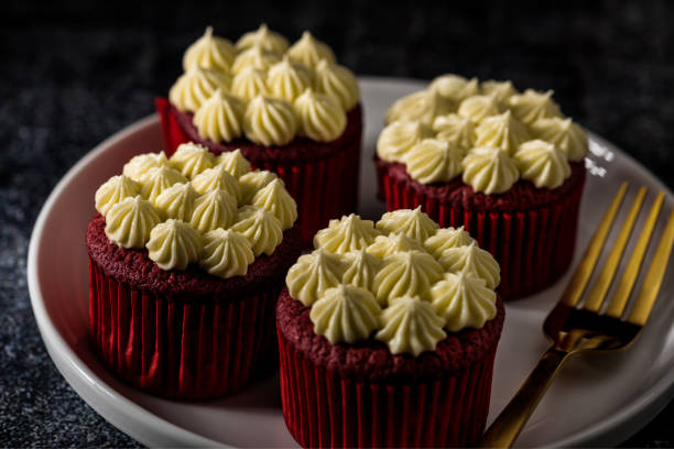 istock Red Velvet cup cakes with cream cheese frosting 902179638