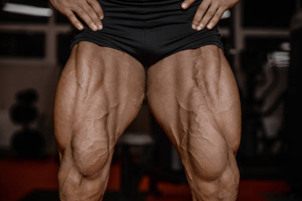 istock Old brutal strong bodybuilder athletic men pumping up muscles with dumbbells 902180442