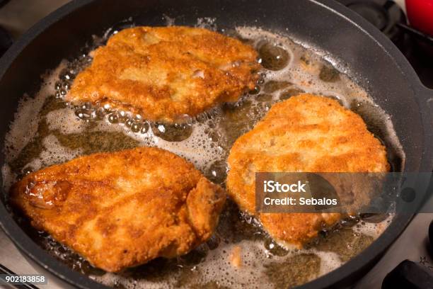 Frying Wiener Schnitzel In A Hot Pan Stock Photo - Download Image Now - Fried, Above, Baked