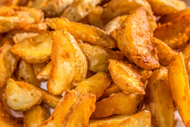 istock Potato wedges with a spicy Mexican coating 902184096