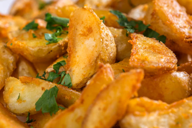 istock Potato wedges with a spicy Mexican coating 902184100