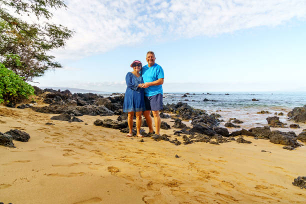 istock Senior couple together on Maui beach 902184936