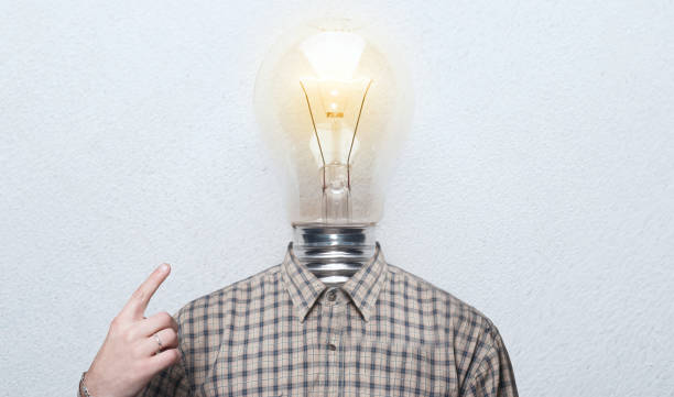 istock man is the light bulb. man in shirt with a light bulb instead of a head. 902192890
