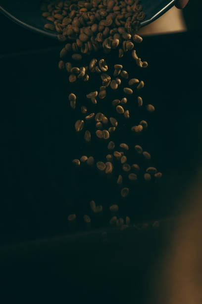 close up view of falling roasted coffee beans