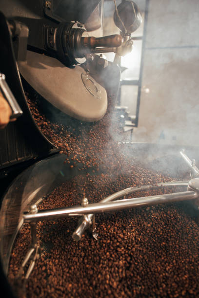 istock close up view of coffee beans roasting in machine 902196280
