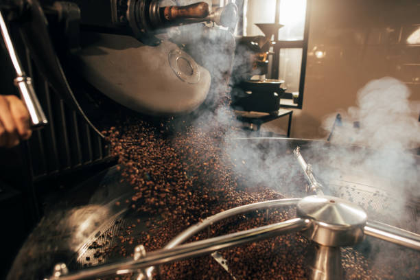 istock close up view of coffee beans roasting in machine 902199240