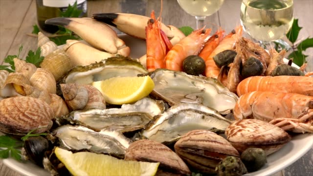 Fresh seafood platter with lobster mussels and oysters on turn table