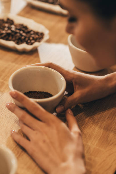 istock woman holding bowl with aromatic grind coffee in hands 902200158