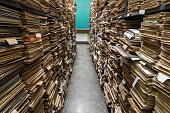 documents in folders on shelves