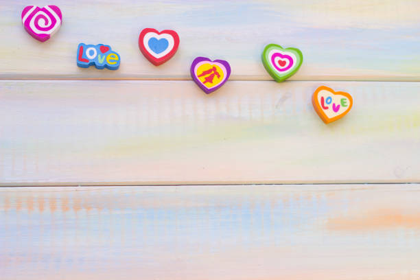 istock St. Valentine's wooden background with candy hearts 902203792