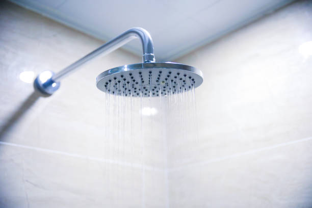 istock Water pouring from a shower head 902206566