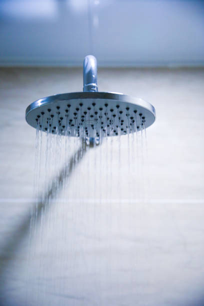 istock Water pouring from a shower head 902206622