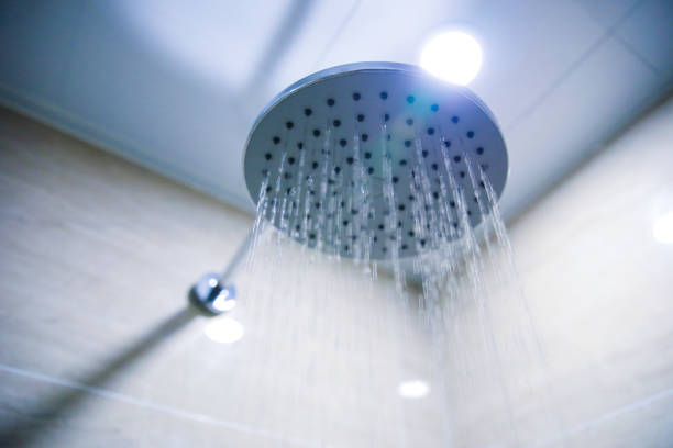istock Water pouring from a shower head 902206650