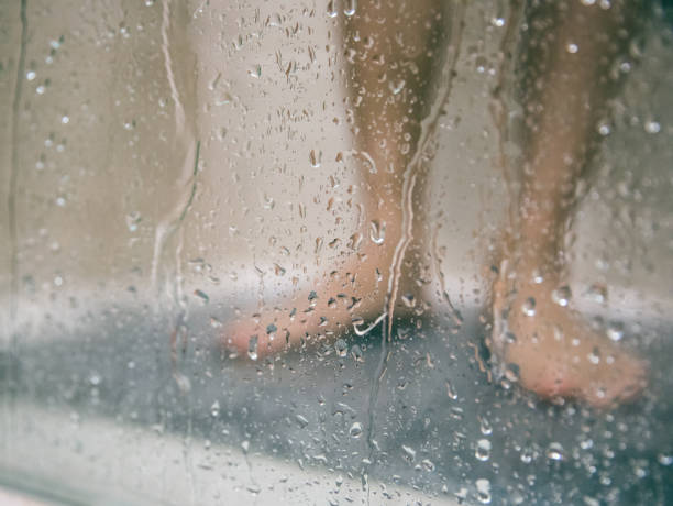 Legs in the Shower stock photo