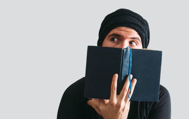 istock Portrait of young men and book 902209444