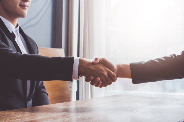 istock Asia Businessman together create a mutually beneficial business relationship. Economic graph on the table 902209862