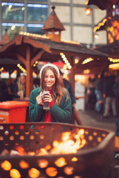 Young woman at Christmas market stock photo