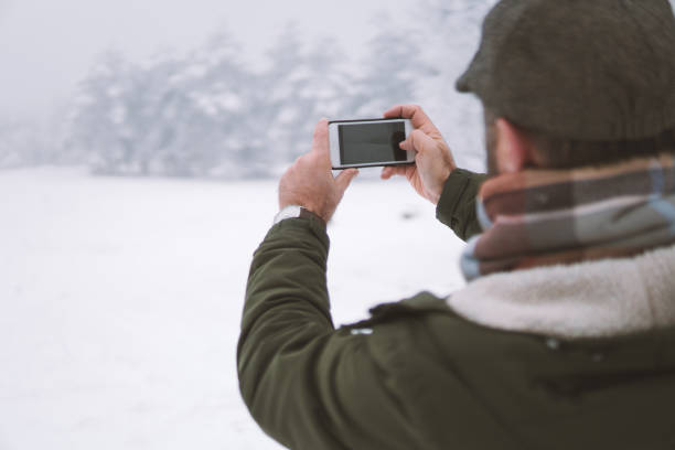 istock Man taking a picture on the forest 902221136