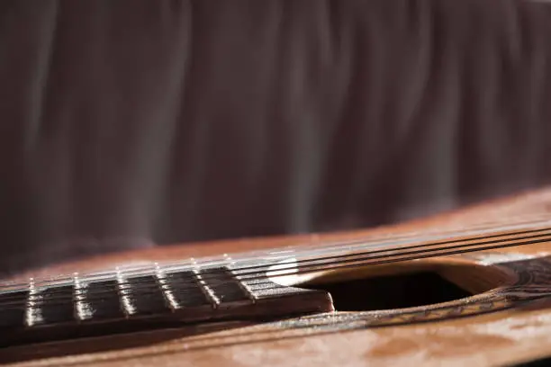 Classical Guitar Covered with Dust Close-up with Copy Space