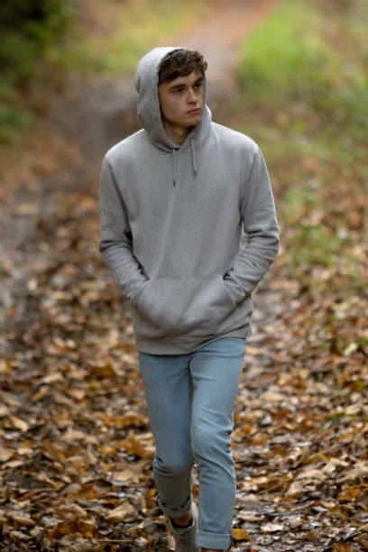istock Teenage boy walking alone on an atumn day 902224814