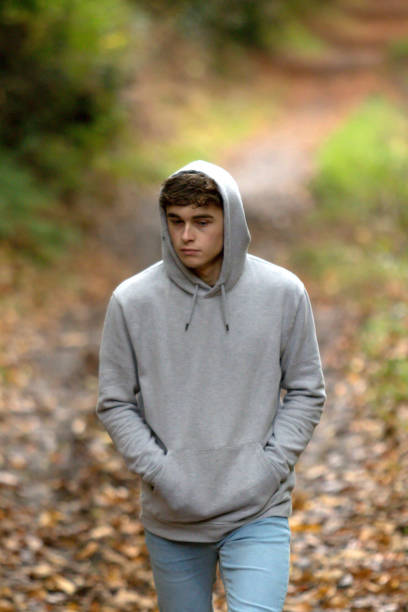 istock Teenage boy walking alone on an atumn day 902224914