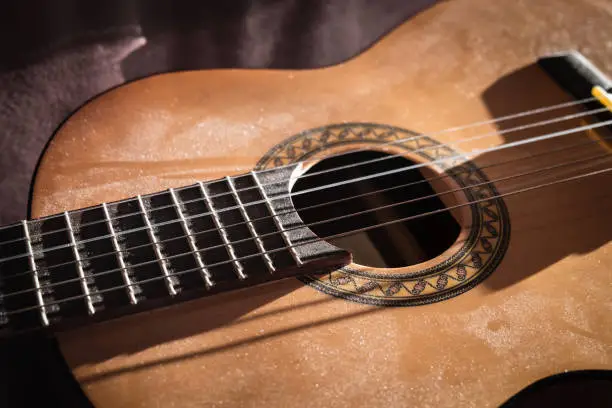 Classical Guitar Covered with Dust Close-up