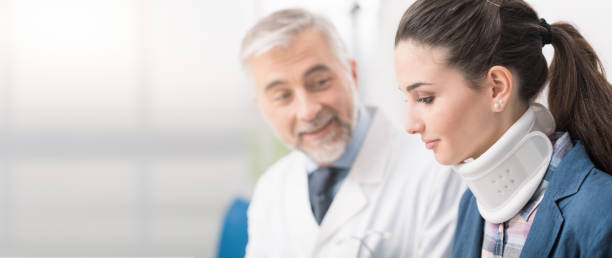 istock Doctor visiting a patient with cervical collar 902224946