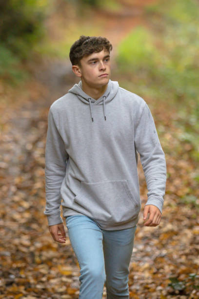 istock Young adult walking outside 902227862