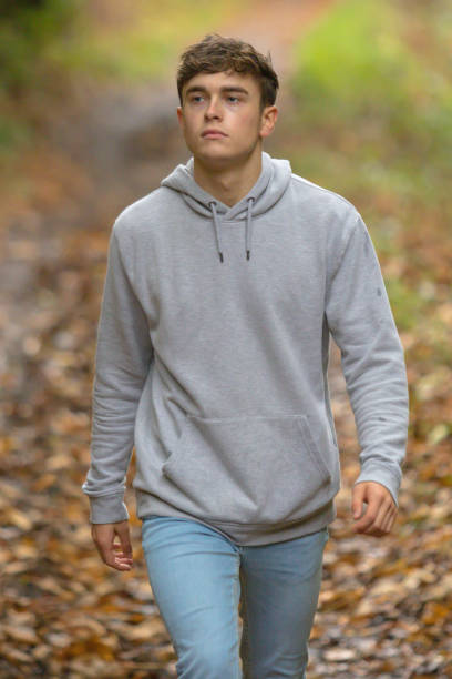 istock Young adult walking outside 902228066