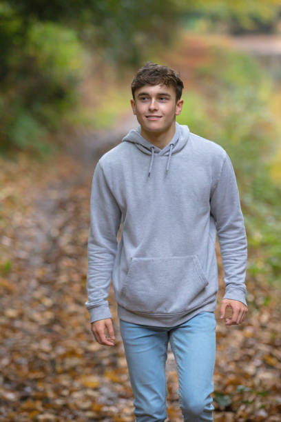 istock Young adult walking outside 902228154