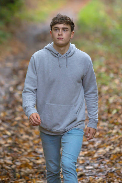 istock Young adult walking outside 902228386
