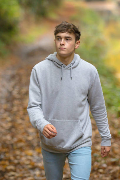 istock Young adult walking outside 902228484
