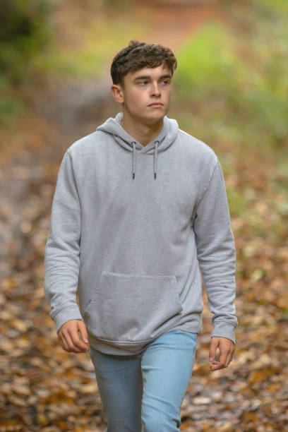 istock Young adult walking outside 902228894