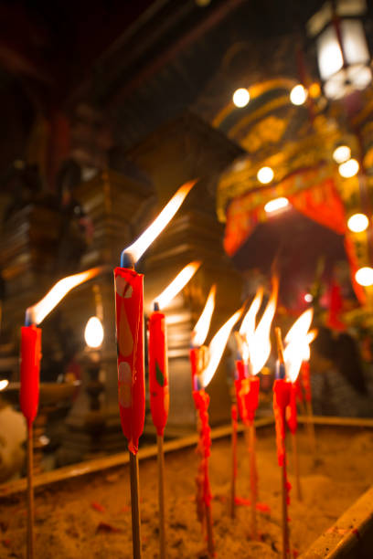 November 3, 2017, Hong Kong: Built in 1847, Man Mo Temple in Sheung Wan, Hong Kong, is a picturesque tribute to the God of Literature (Man) and the God of War (Mo), both of whom are worshipped by students looking to succeed in examinations. Candles are burning in an incense burner in the temple.